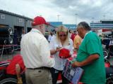 Indylights driver Pippa Mann giving autographs